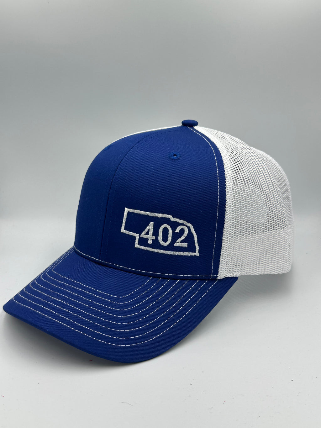 Nebraska 402 Trucker Hat Blue